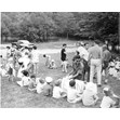 A group of young campers seated on the ground in a country setting, with camp counselors and staff people. Camp Kadimah, 1962. Ontario Jewish Archives, Blankenstein Family Heritage Centre, fonds 33, series 5, file 8.|
